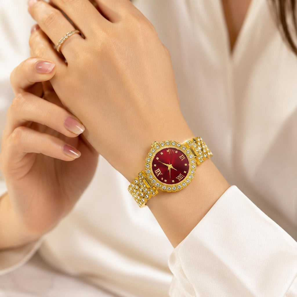 Women's gemstone watch with red face on gold band from Republic Mercantile, showcasing elegant jewelry design.