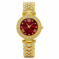 Women's gemstone watch with a red face and gold band by Republic Mercantile, showcasing elegant jewelry design.