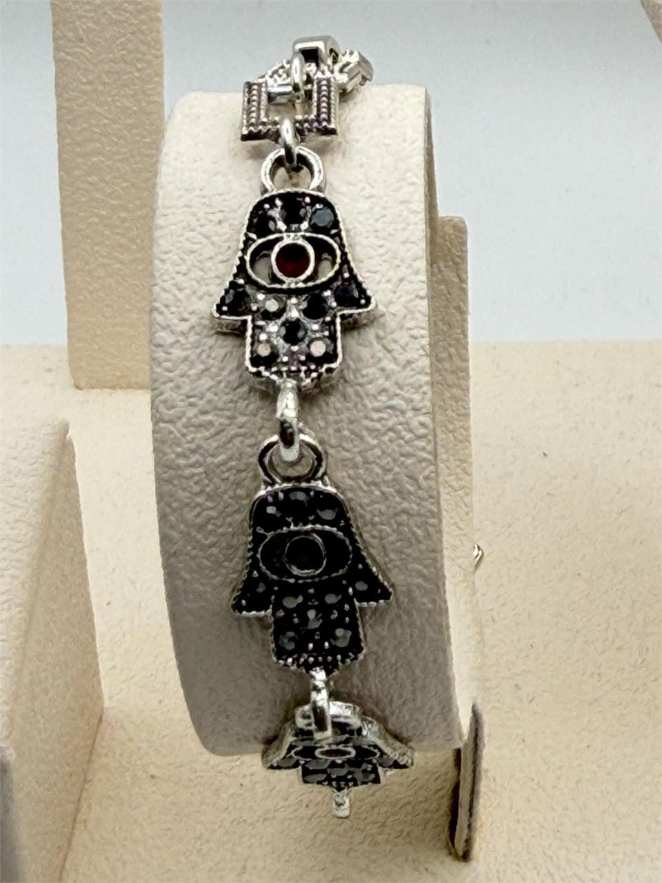 Women's Hamsa hand-link bracelet with marcasite-style accents, featuring intricate design and silver-tone metal.