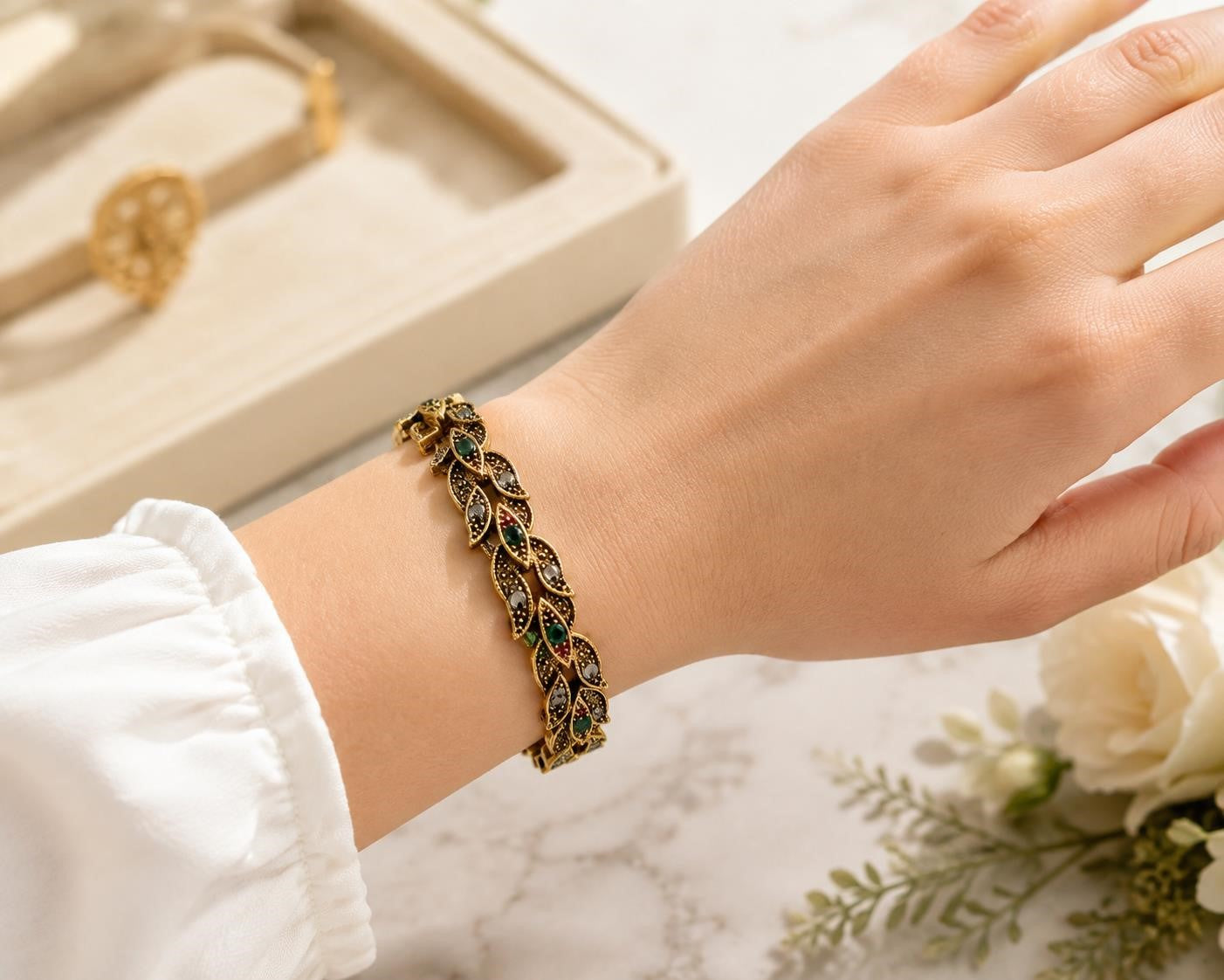 Vintage style gold tone leaf rhinestone bracelet with intricate leaf design and sparkling rhinestones, by Republic Mercantile.