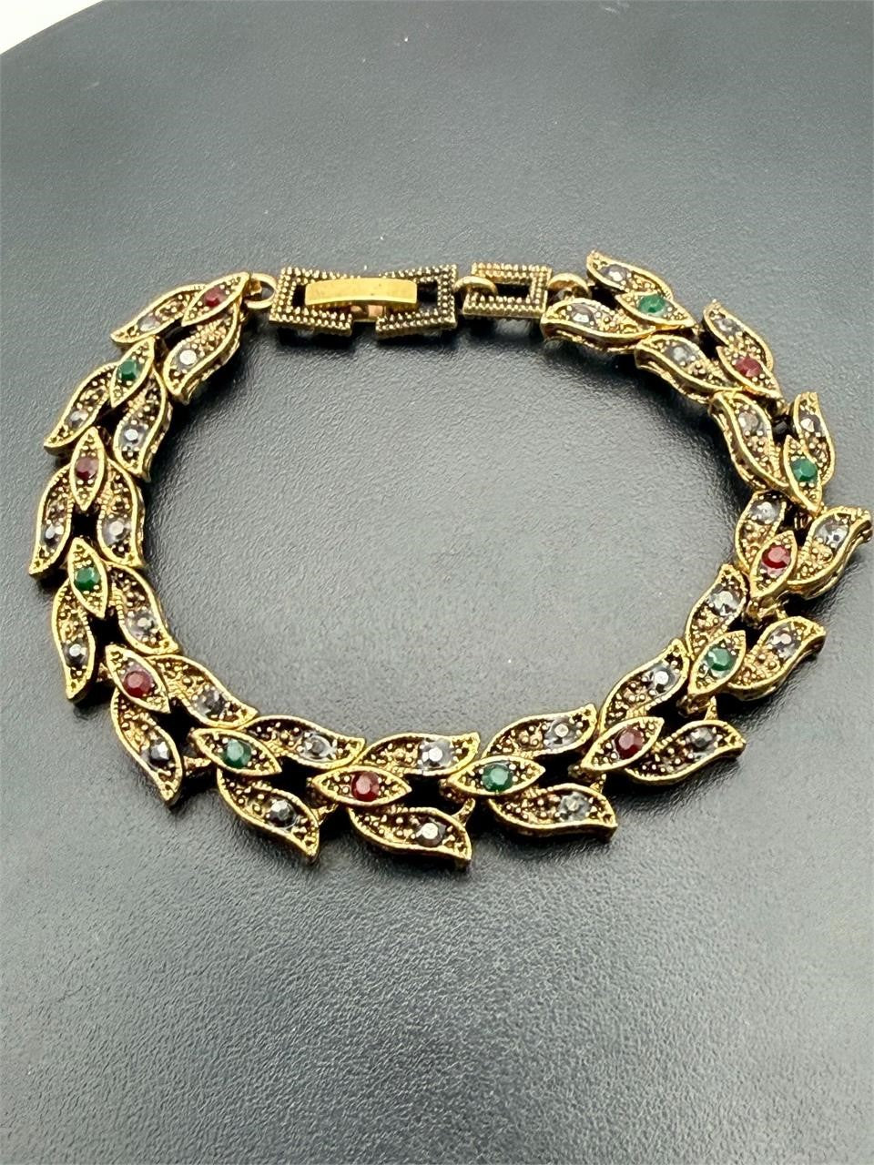 Vintage style gold tone leaf rhinestone bracelet with intricate leaf design and sparkling rhinestones, from Republic Mercantile.