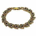 Vintage style gold tone leaf rhinestone bracelet by Republic Mercantile featuring intricate leaf design and sparkling rhinestones.