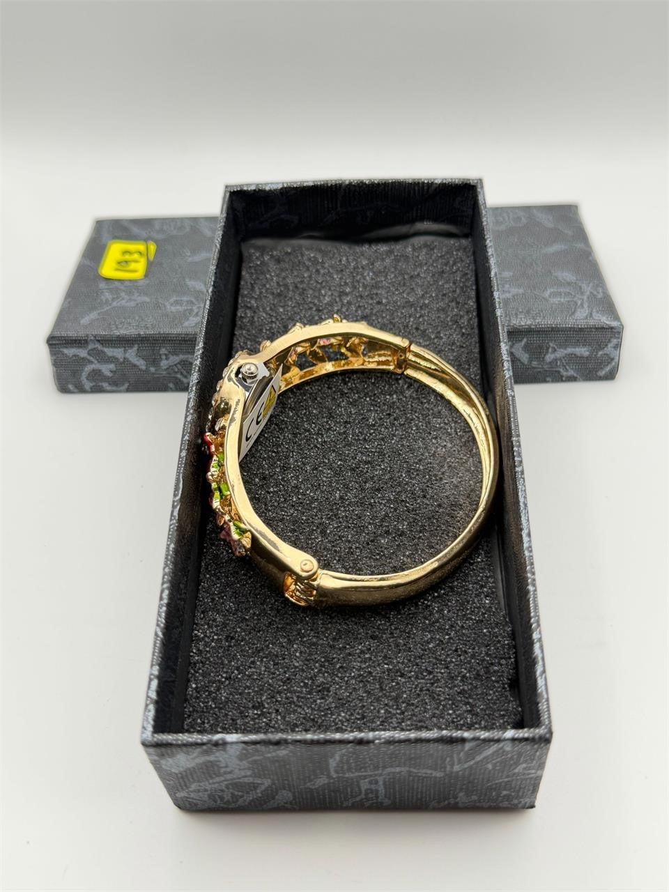 Enamel flower cuff watch by Republic Mercantile featuring floral design and rhinestones, displayed on a white background.