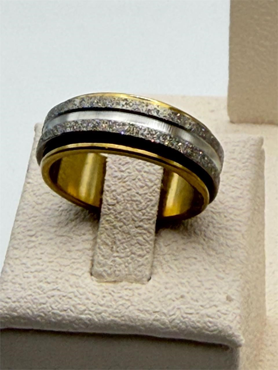 Silver and gold tone man's spinner ring in size 8 from Republic Mercantile, featuring a sleek, multi-tone design with a smooth finish.