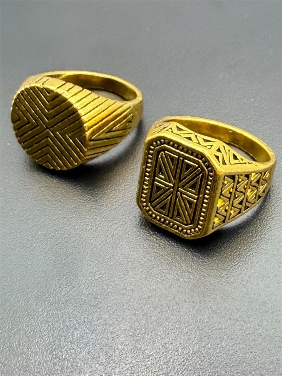 Pair of men's gold tone rings in size 9 from Republic Mercantile, featuring smooth polished finish and classic design.