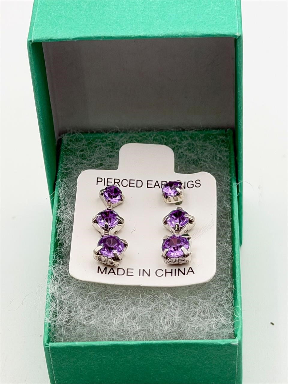 Set of three crystal purple gem earrings in small, medium, and large sizes, featuring silver hooks, by Republic Mercantile.