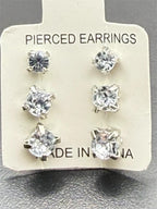 Three pairs of Republic Mercantile crystal clear gem earrings in small, medium, and large sizes displayed together.
