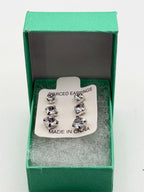 Three pairs of crystal clear gem earrings in small, medium, and large from Republic Mercantile displayed on a white background.