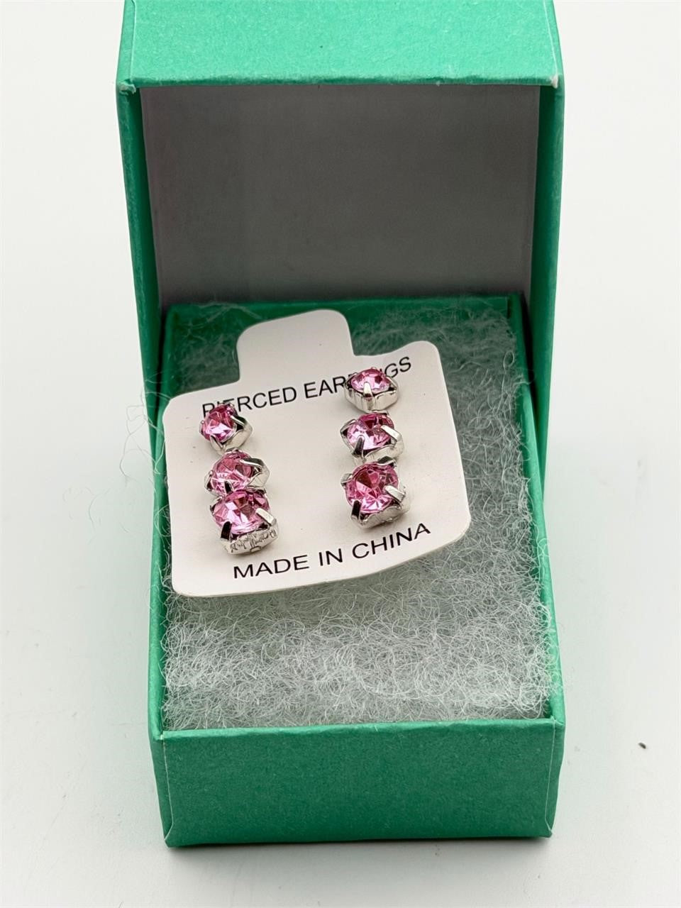 Three pairs of pink crystal gem earrings in small, medium, and large sizes, featuring sparkling crystal accents from Republic Mercantile.