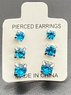 Three pairs of blue crystal gem earrings in small, medium, and large sizes from Republic Mercantile, showcasing sparkling gemstone designs.