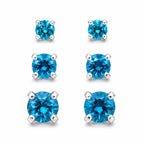 Three pairs of blue crystal gem earrings in small, medium, and large sizes by Republic Mercantile arranged on a white background.