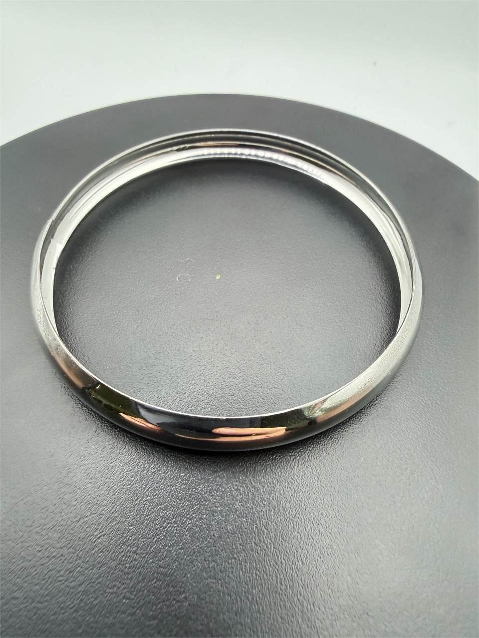 Simple and lite silvery bangle bracelet from Republic Mercantile, showcasing a sleek, minimalist design on a plain background.
