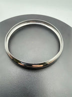 Simple and lite silvery bangle bracelet from Republic Mercantile, showcasing a sleek, minimalist design on a plain background.