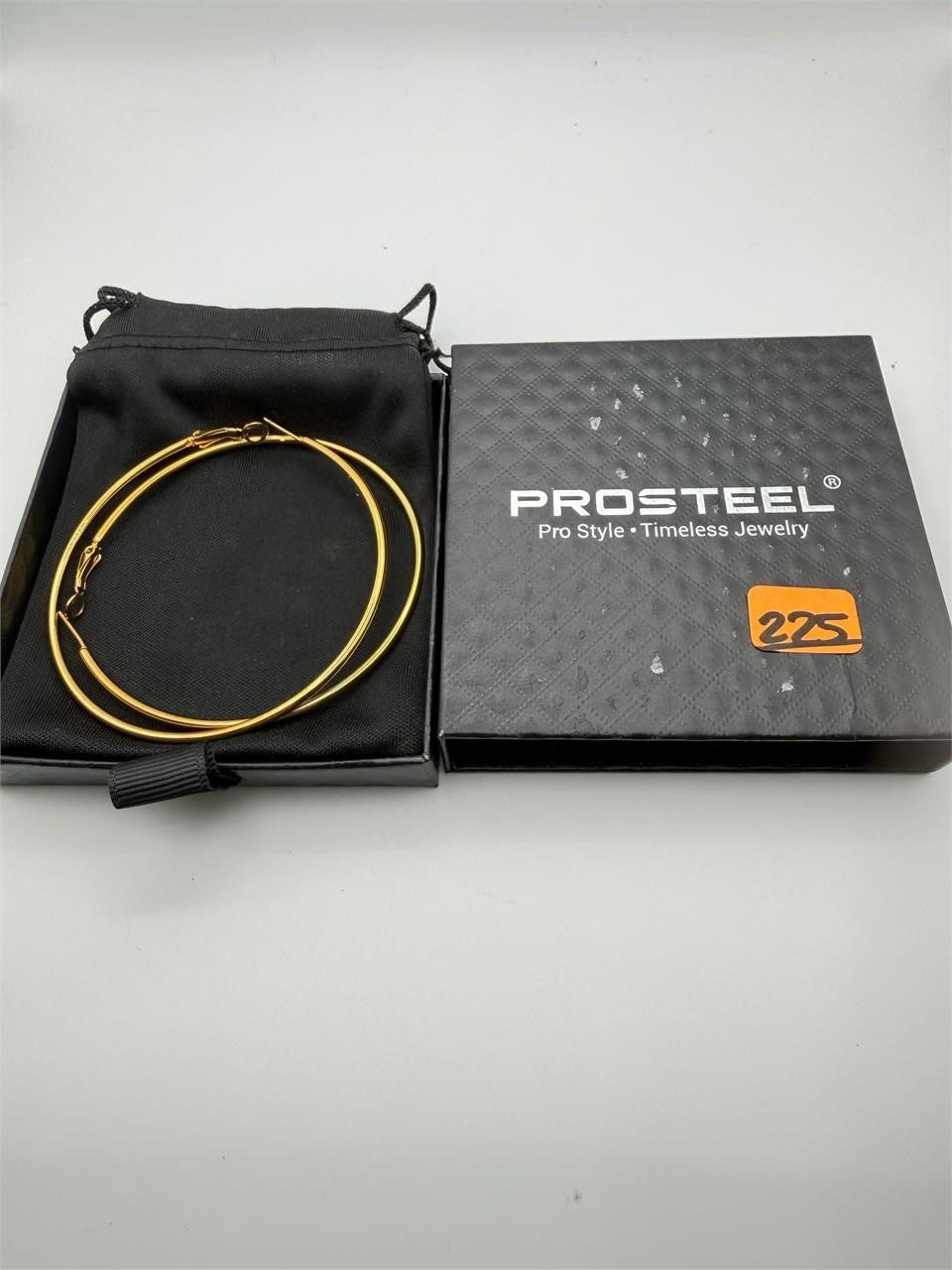 Gold stainless steel hoop earrings, 3-inch size, stylish jewelry by Republic Mercantile, displayed on a neutral background.