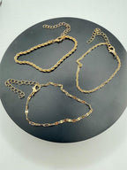 Set of 3 gold tone chain bracelets from Republic Mercantile featuring layered chain designs and adjustable clasps.