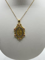 Mother Mary pendant necklace with rose accent, featuring a detailed religious charm on a silver chain by Republic Mercantile.