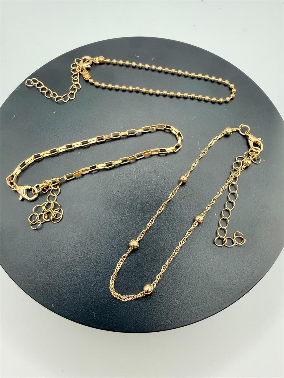 Set of 3 gold tone chain bracelets from Republic Mercantile, featuring layered metallic chain designs for a stylish look