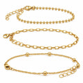 Set of 3 gold tone chain bracelets from Republic Mercantile with layered, stylish link designs on a white background.