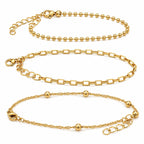 Set of 3 gold tone chain bracelets from Republic Mercantile with layered, stylish link designs on a white background.