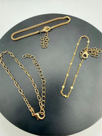 Set of three gold tone chain bracelets by Republic Mercantile featuring layered links and adjustable clasps.