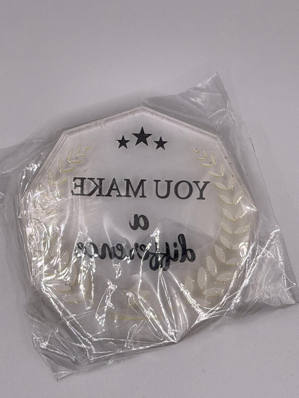 A 2.5-inch clear acrylic award with "You Make a Difference" engraved, awarded by Republic Mercantile, displayed on a wooden surface.