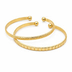 Two gold tone bangle bracelets from Republic Mercantile, featuring sleek and polished jewelry design for stylish accessories.