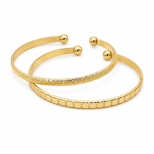 Two gold tone bangle bracelets from Republic Mercantile, featuring sleek and polished jewelry design for stylish accessories.