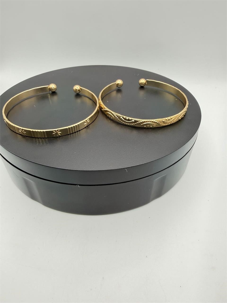 Two gold tone bangle bracelets from Republic Mercantile, stylish and shiny jewelry set for women.