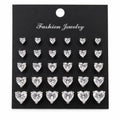 12 pairs of heart-shaped rhinestone earrings by Republic Mercantile displayed in a close-up image.