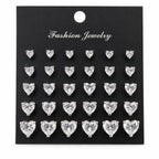 12 pairs of heart-shaped rhinestone earrings by Republic Mercantile displayed in a close-up image.