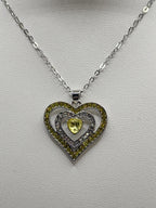 Yellow heart pendant necklace from Republic Mercantile featuring a gold-tone heart charm on a delicate chain.
