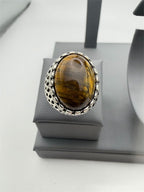 Men's antique silver-toned ring with tiger's eye stone, size 8, from Republic Mercantile, featuring a detailed and polished design.