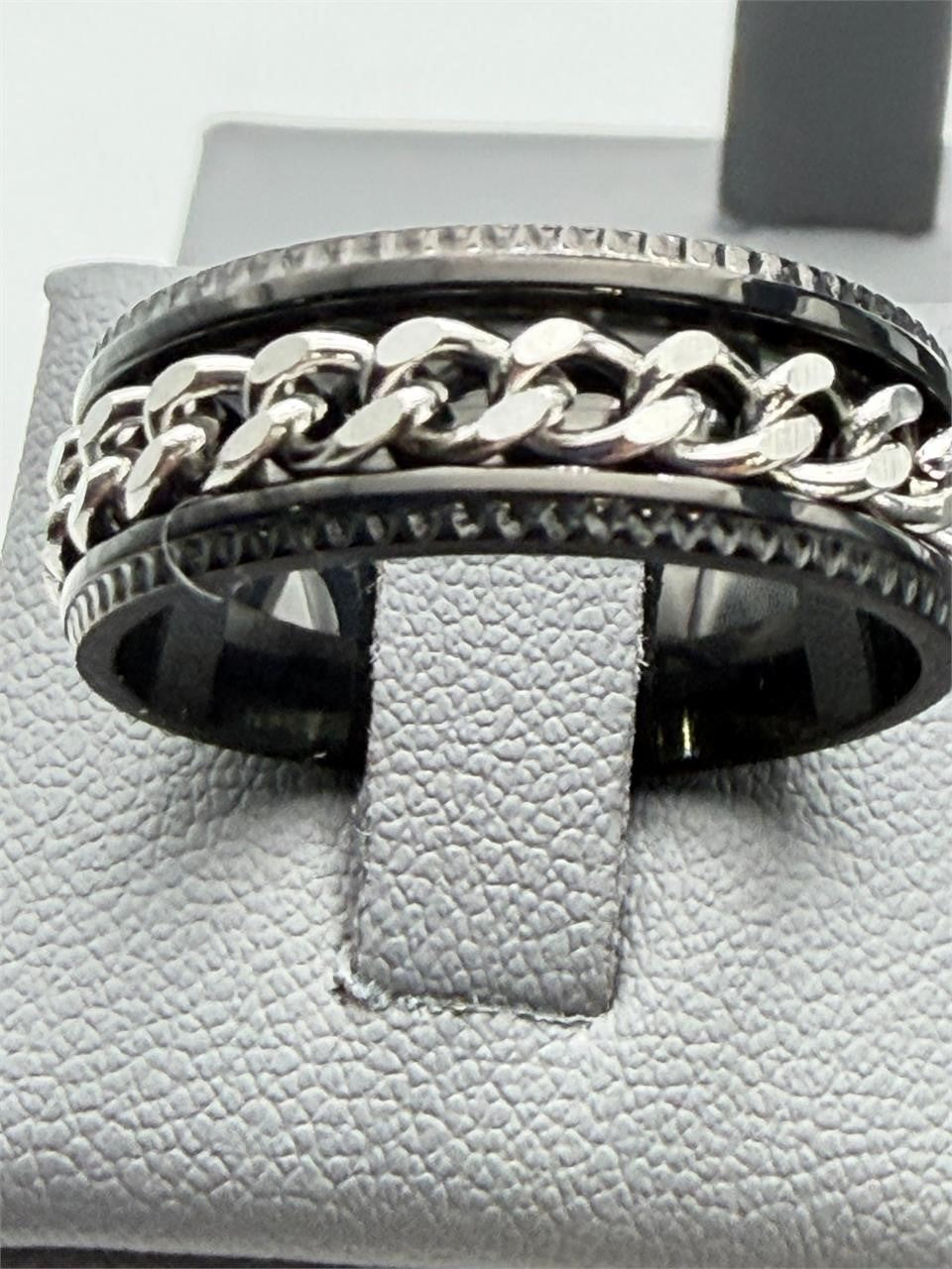 Men's silver chain-link ring on black band, size 10, from Republic Mercantile, featuring a stylish and modern design.