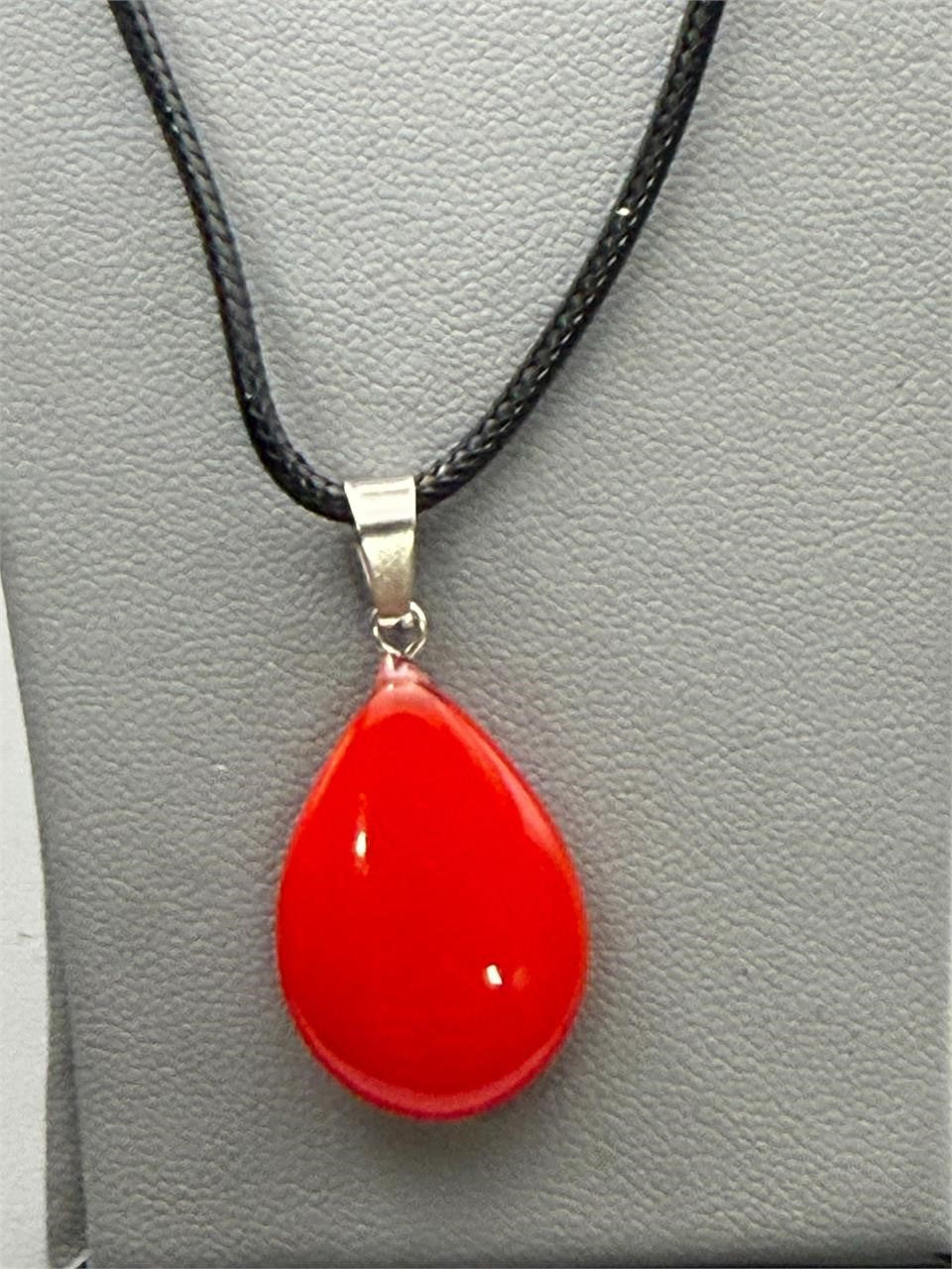 Red teardrop stone pendant necklace with rope chain, featuring a Republic Mercantile jewelry design, on a neutral background.