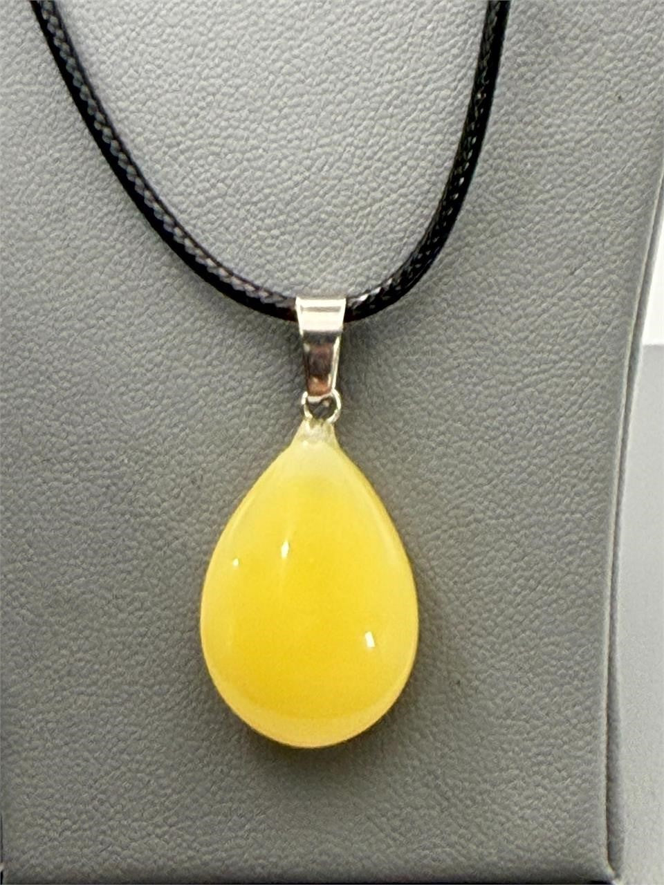 Yellow teardrop stone pendant necklace with rope chain by Republic Mercantile, featuring a polished yellow teardrop stone.