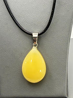 Yellow teardrop stone pendant necklace with rope chain by Republic Mercantile, featuring a polished yellow teardrop stone.