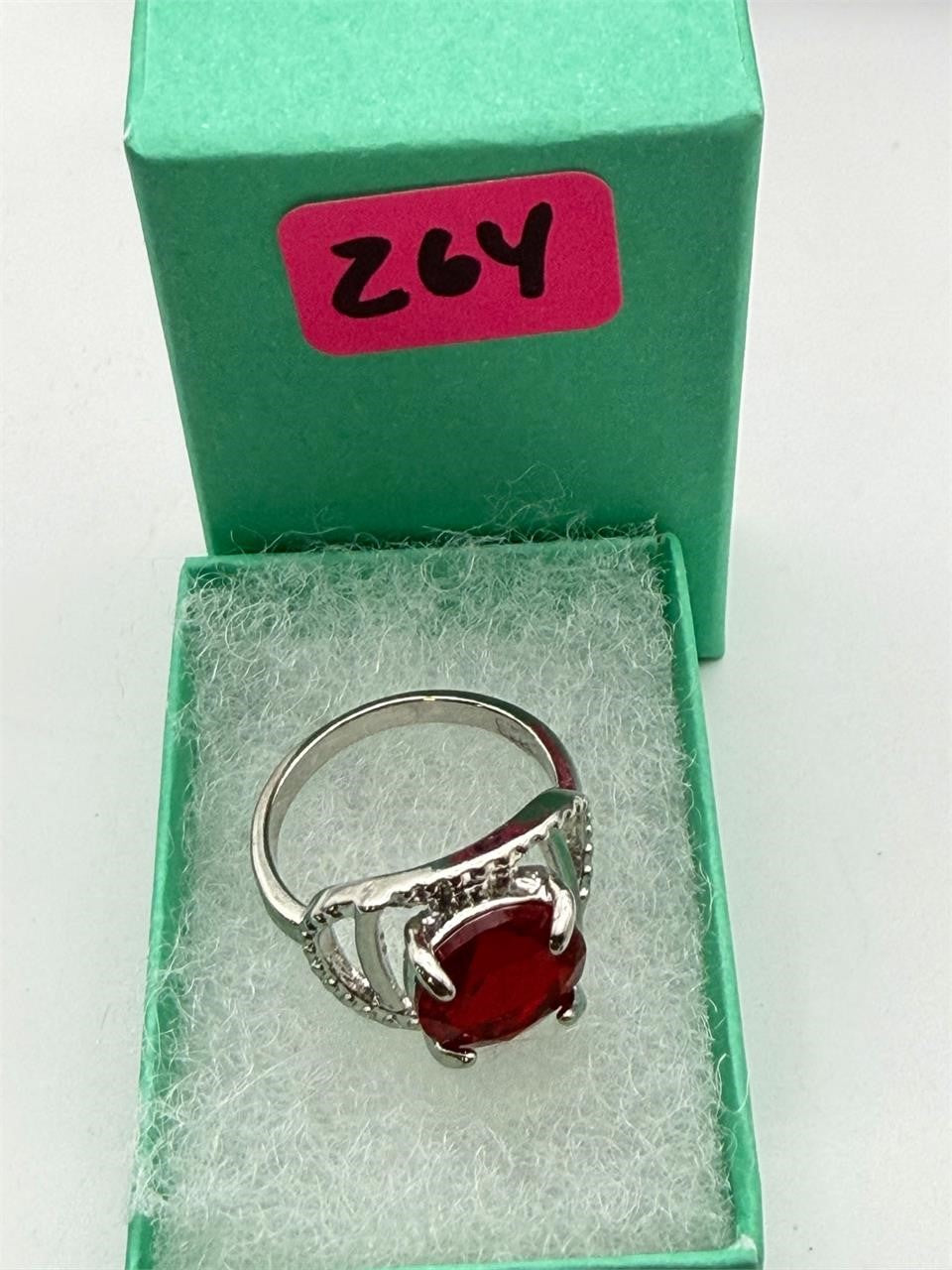 Sterling silver women's ring with a red spinel solitaire gemstone in size 7, featuring a sleek and elegant design.