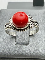 Sterling silver women's ring with a red agate gemstone in size 7, featuring a polished band and gemstone setting.