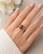 Sterling silver women's ring with copper and goldstone gem, size 6, featuring a polished band and vibrant stone setting.