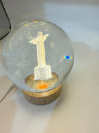 Laser etched crystal ball with LED stand displaying a Christ design, made by Republic Mercantile.
