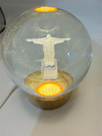 Laser etched crystal ball with LED stand featuring Christ design, crafted by Republic Mercantile.