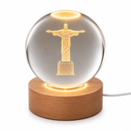 Laser etched crystal ball with LED stand featuring Christ design, crafted by Republic Mercantile, displayed on a black background.