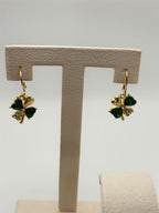 Pair of Shamrock green and gold fashion earrings by Republic Mercantile, featuring intricate leaf design and shiny finish.