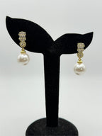 Elegant pearl drop fashion earrings by Republic Mercantile featuring lustrous pearls and silver hooks.