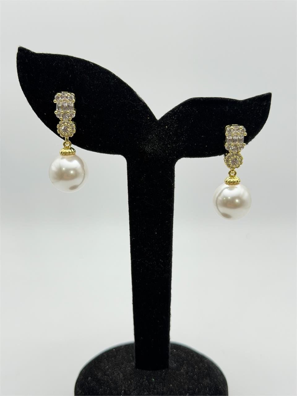 Elegant pearl drop fashion earrings by Republic Mercantile featuring lustrous pearls and silver hooks.
