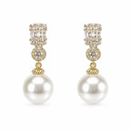 Elegant pearl drop fashion earrings by Republic Mercantile, featuring lustrous pearls and delicate metal hooks for a sophisticated look.
