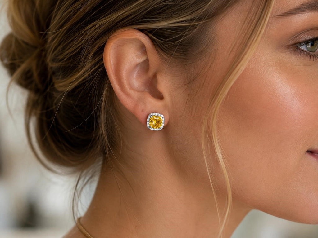Yellow crystal stud earrings with halo design from Republic Mercantile, featuring sparkling crystal accents and a classic stud style.