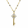 Gold tone crystal key pendant necklace with sparkling crystals and chain, stylish jewelry piece by Republic Mercantile.