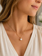 Gold tone chain necklace with single pearl pendant, fashion jewelry by Republic Mercantile.
