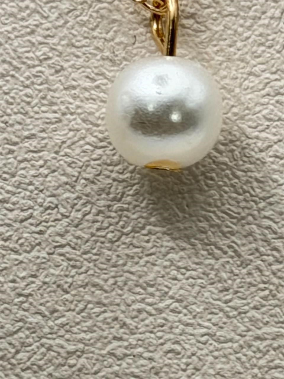 Gold tone chain necklace with single pearl pendant from Republic Mercantile, stylish fashion jewelry accessory.